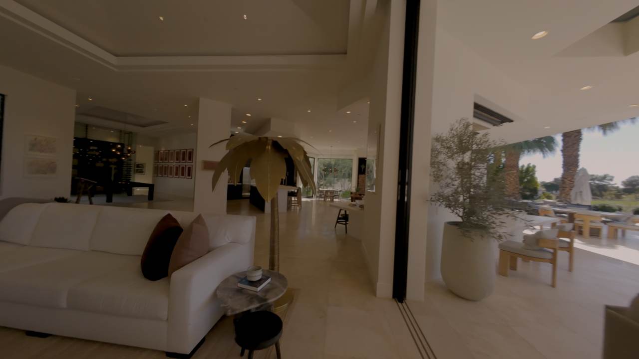 Great room with the glass wall pocketed open to the terrace